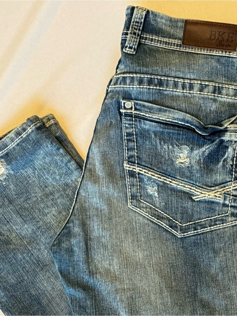 BKE Women’s Medium Blue Slim Straight Jeans with Distressed Back Pocket